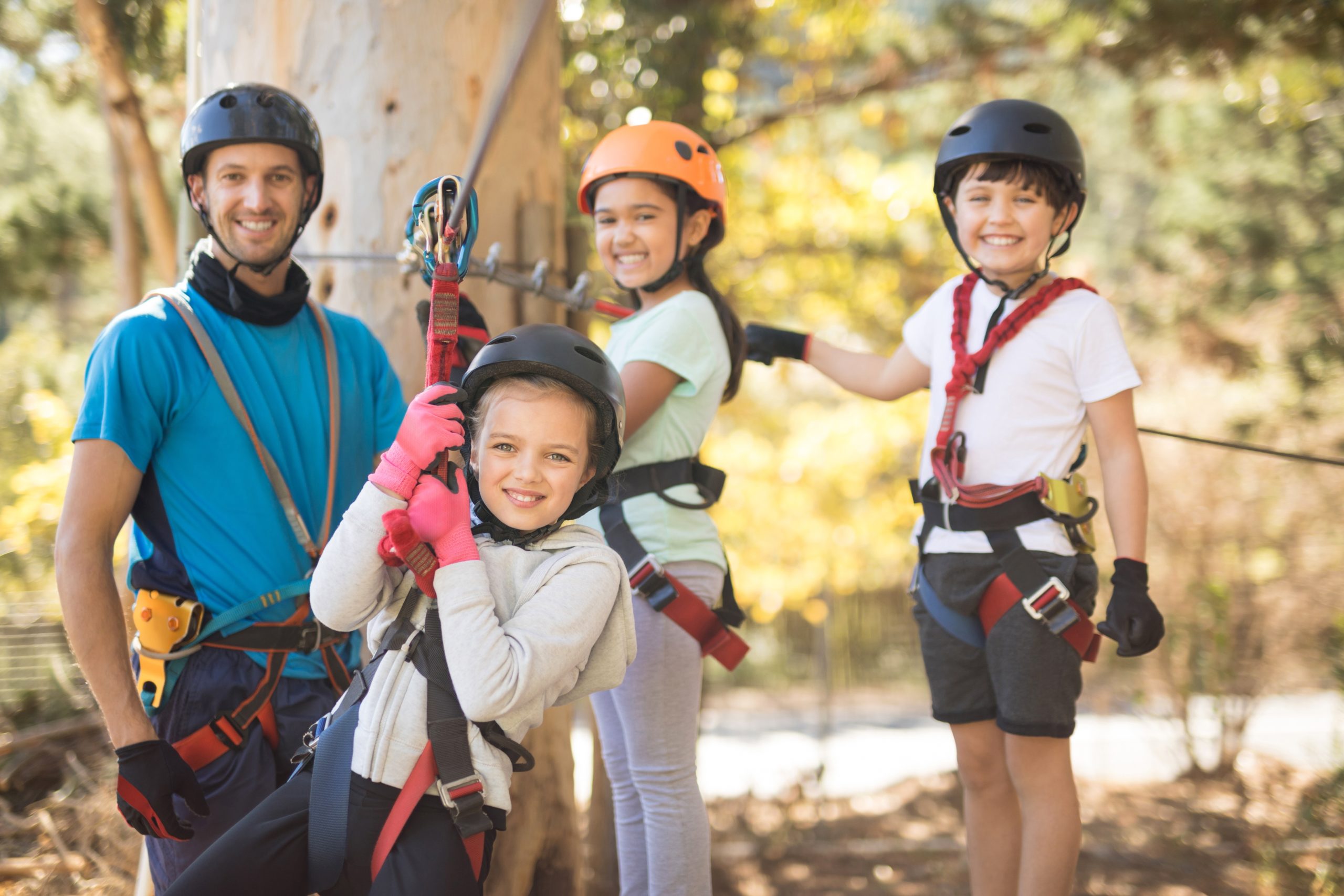 kids enjoying zip line adventure on sunny day in durango colorado